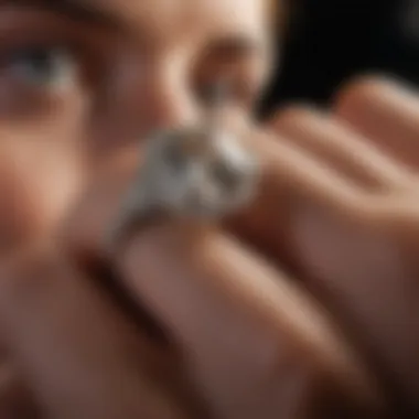 Expert examining an antique cut diamond ring under magnification to assess its quality.