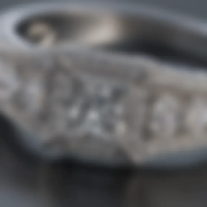 Close-up of a princess cut pave diamond engagement ring showcasing intricate designs