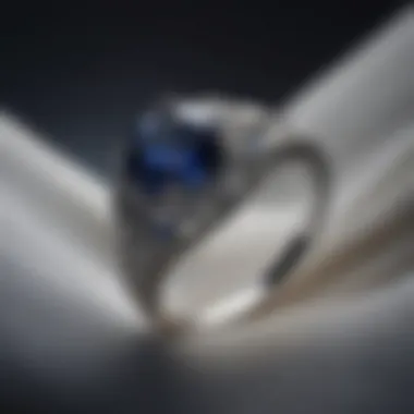 A dazzling sapphire engagement ring set against a soft velvet background.