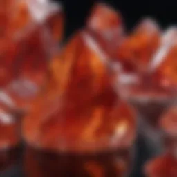 A stunning red orange crystal displayed on a reflective surface, showcasing its intricate patterns and hues.